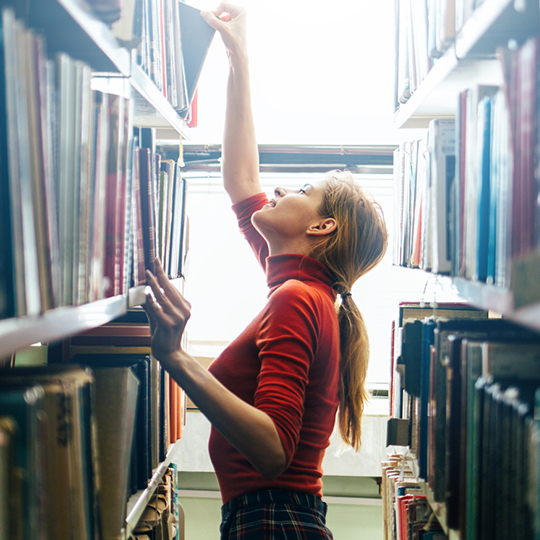 Looking through library shelves_Collections